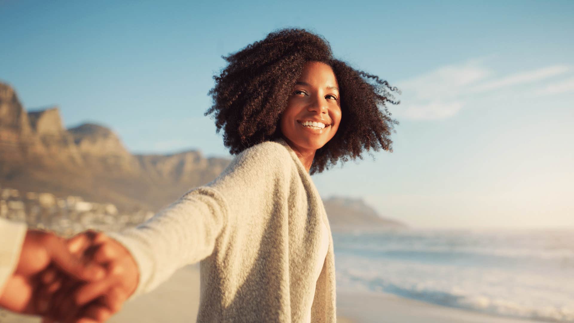 woman happily reaching out her hand