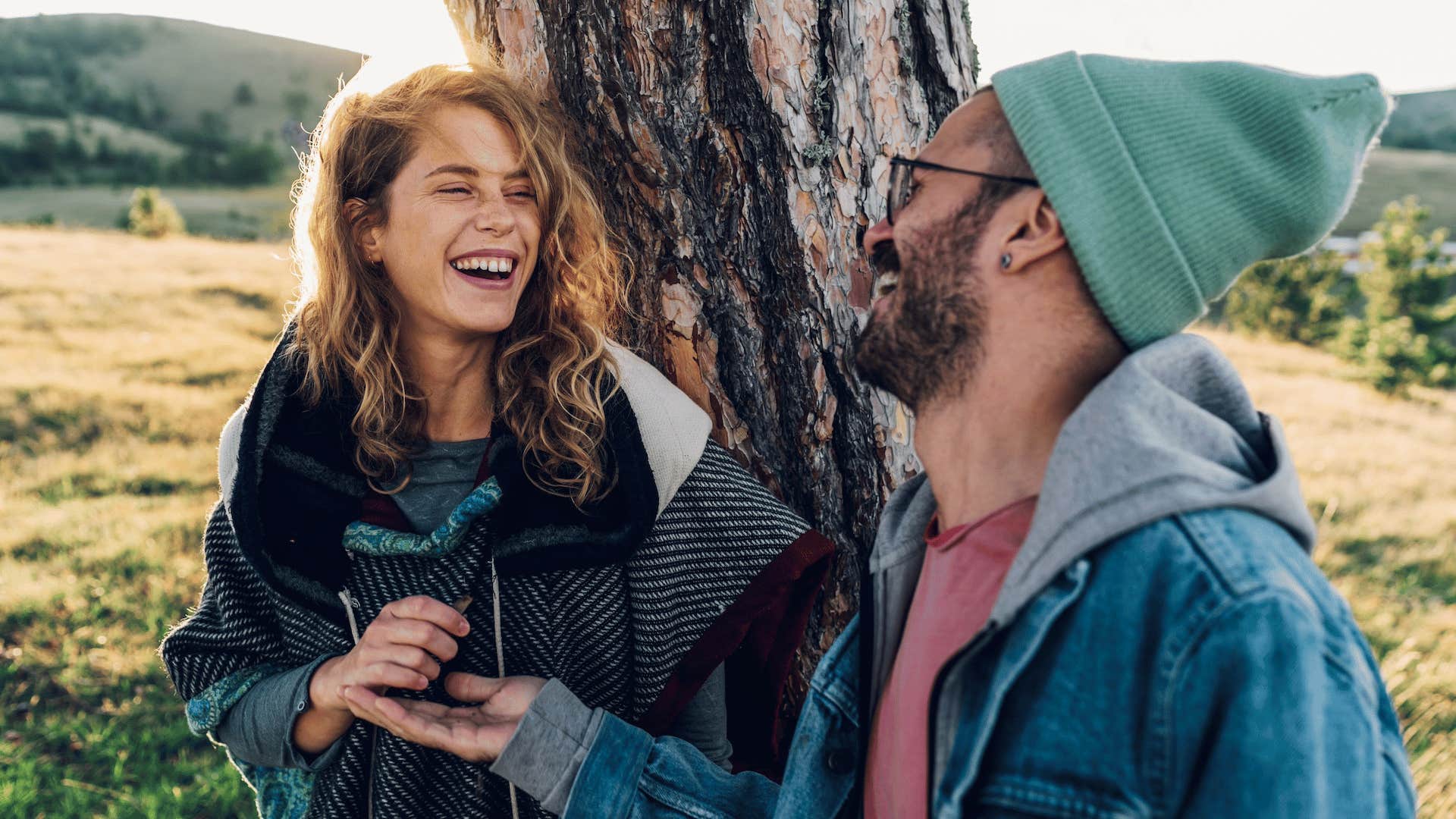 Excited couple talking outdoors