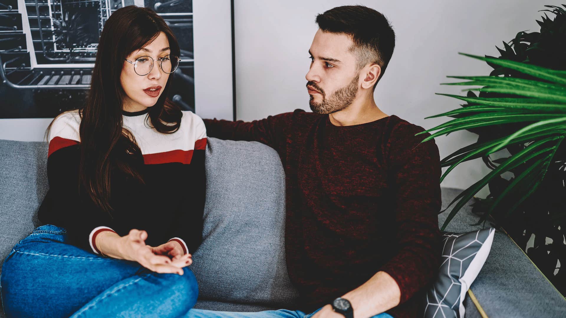 Couple having serious conversation while man listens carefully