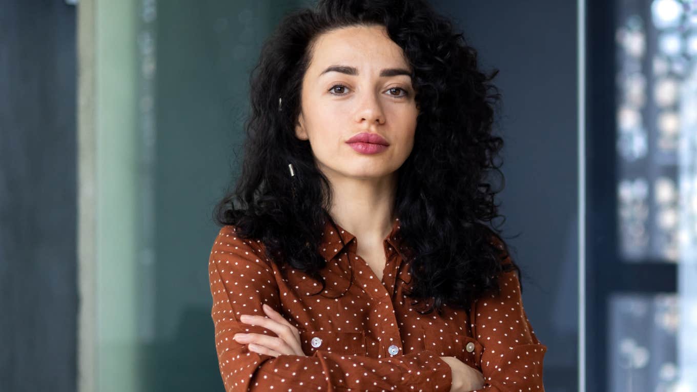 respectable woman with her arms crossed