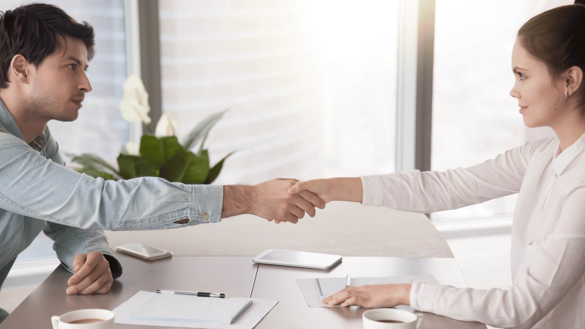 man and woman shaking hands