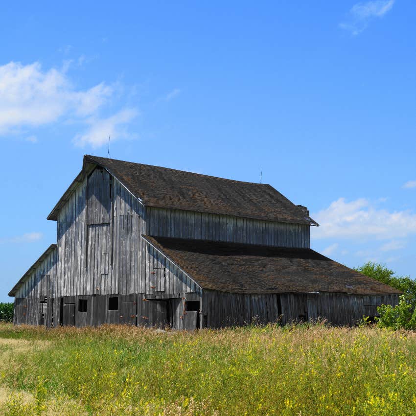 Weathered gray barn on the farm of someone who grew up poor in America