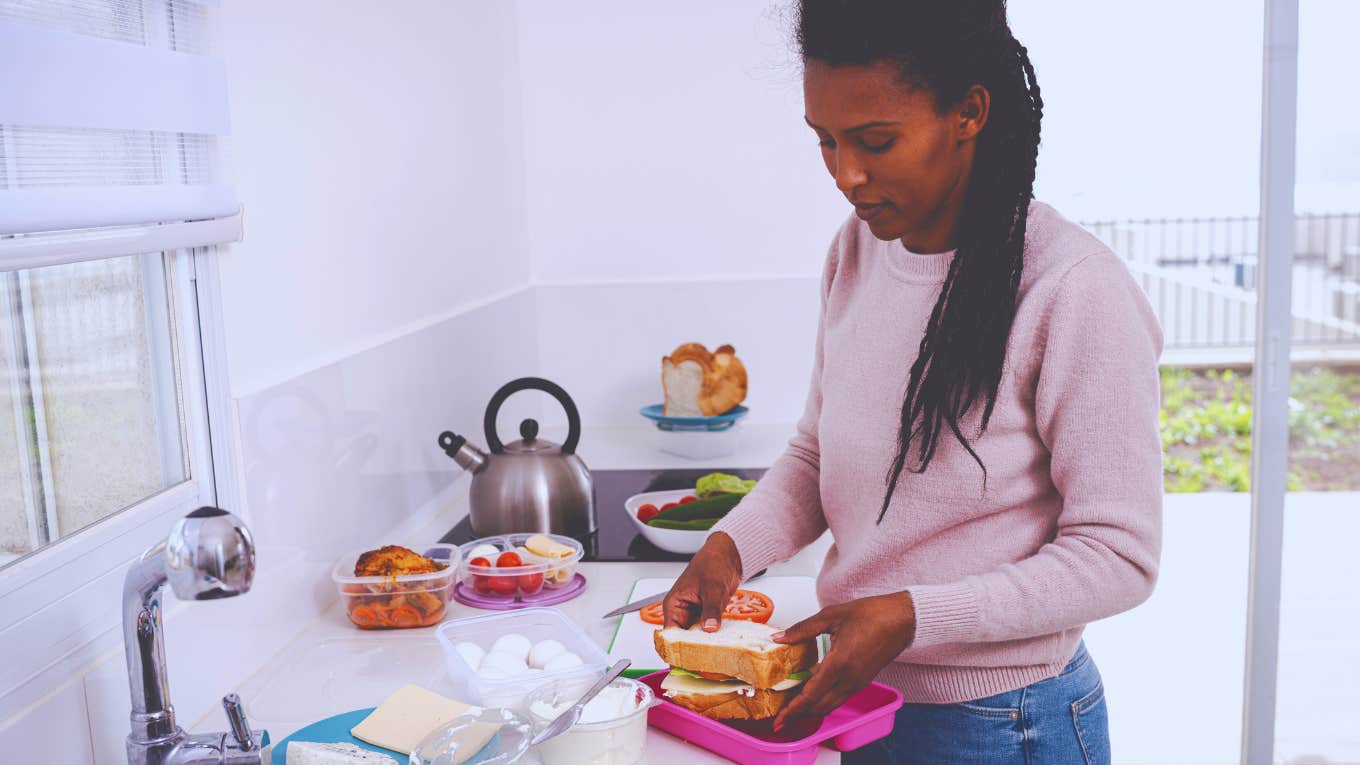 woman packing a lunch in her kitchen