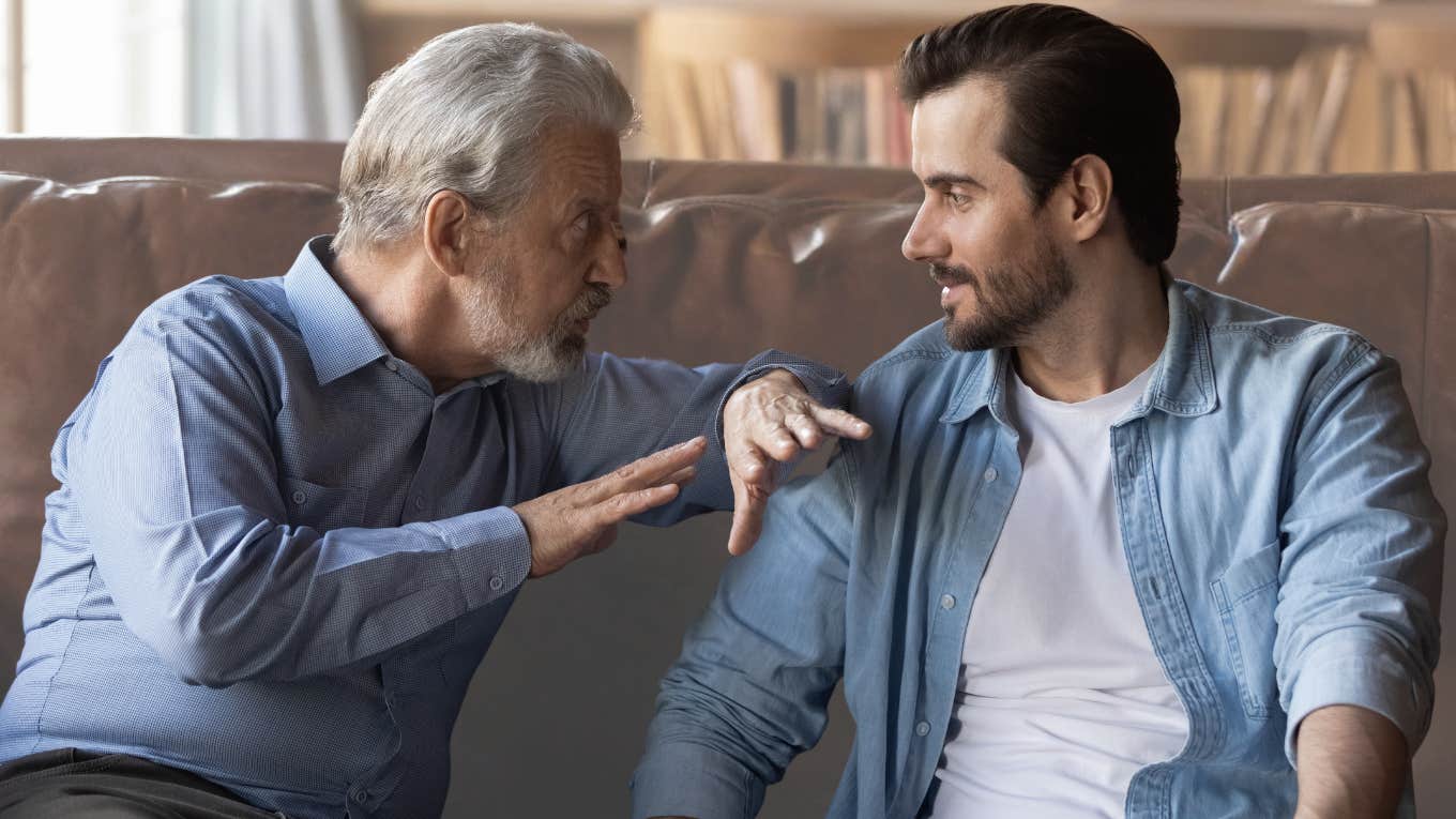 Boomer dad and husband having a conversation on couch. 