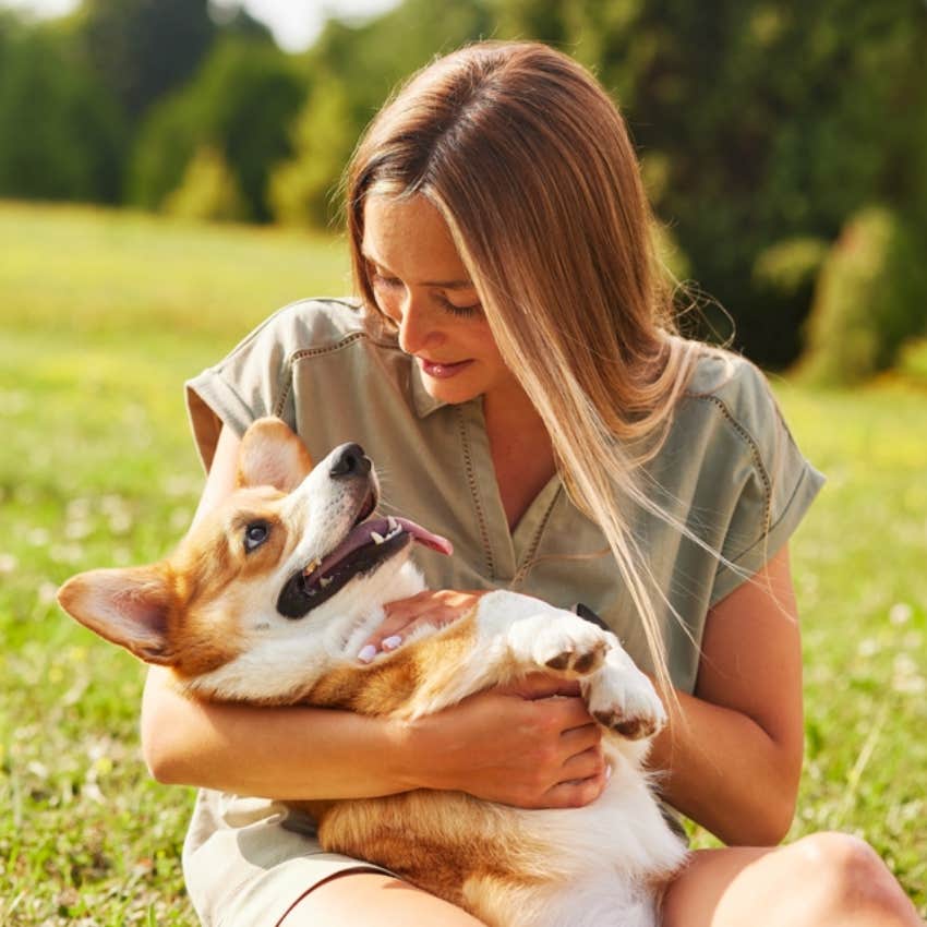 woman and corgi 