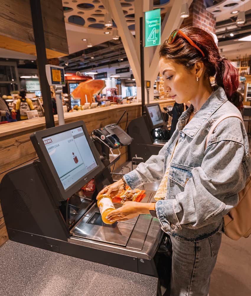 woman at self checkout 