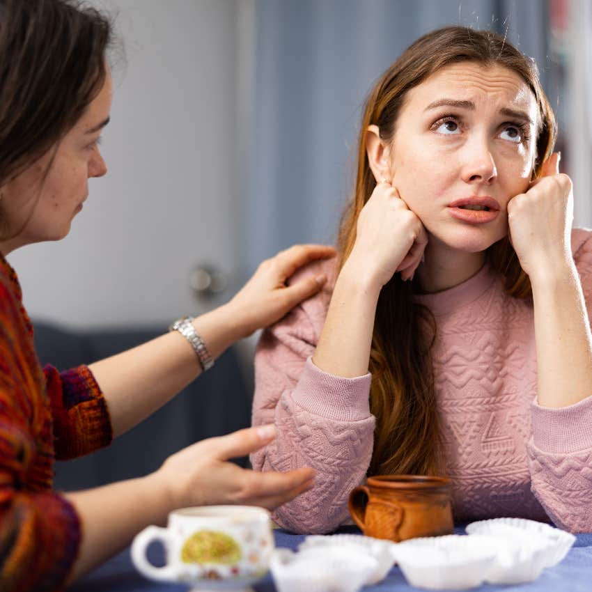 Anxious woman letting her friend cross her boundaries