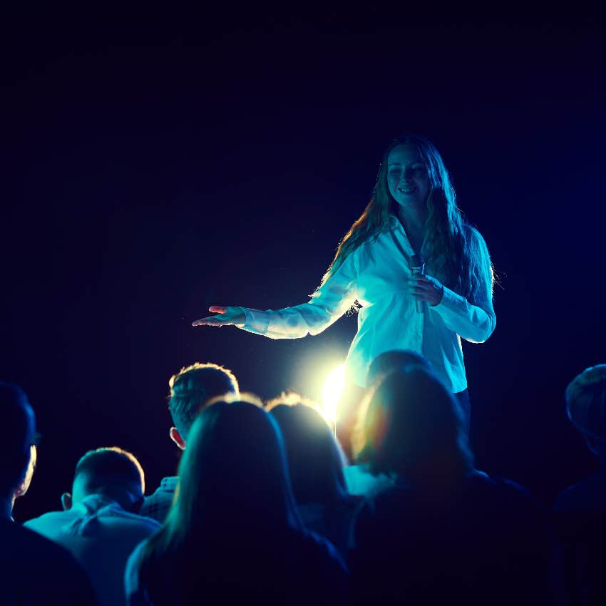 Woman performing at a comedy show