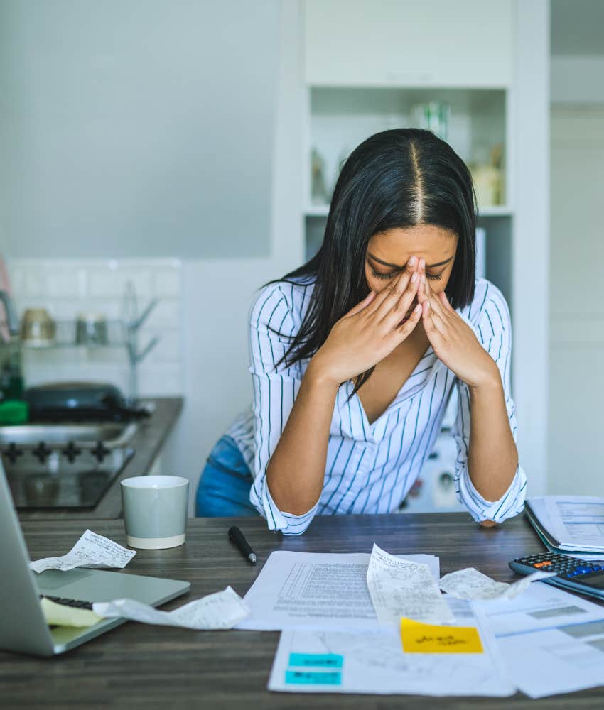 woman dealing with the stress of credit card fraud