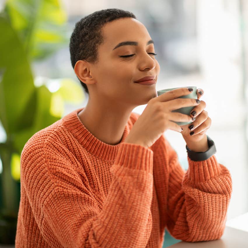 Calm woman drinking tea