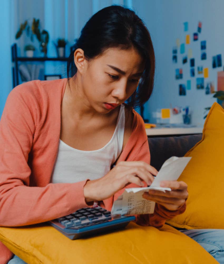 Woman looking through her receipts carefully