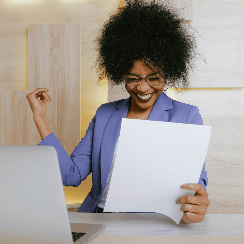 woman happy with results on paper