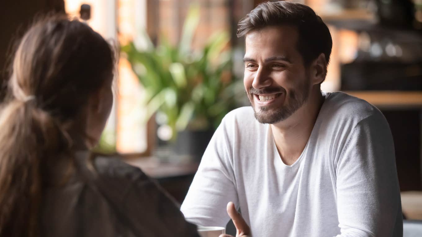 man sitting across from woman on a date at restaurant