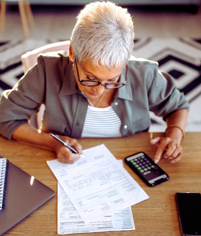 woman looking at financial documents