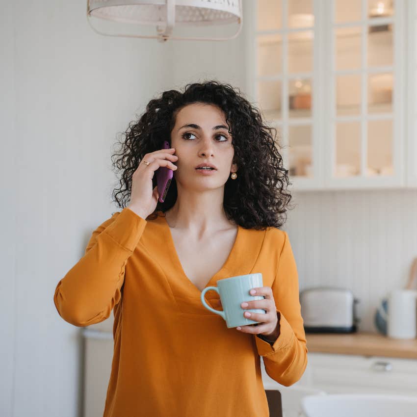 Surprised woman on the phone with her friend