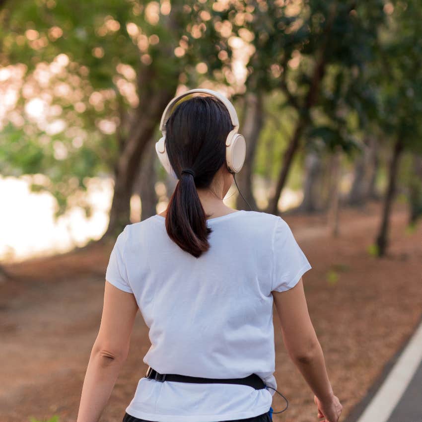 Woman walking outside while struggling through a hard time