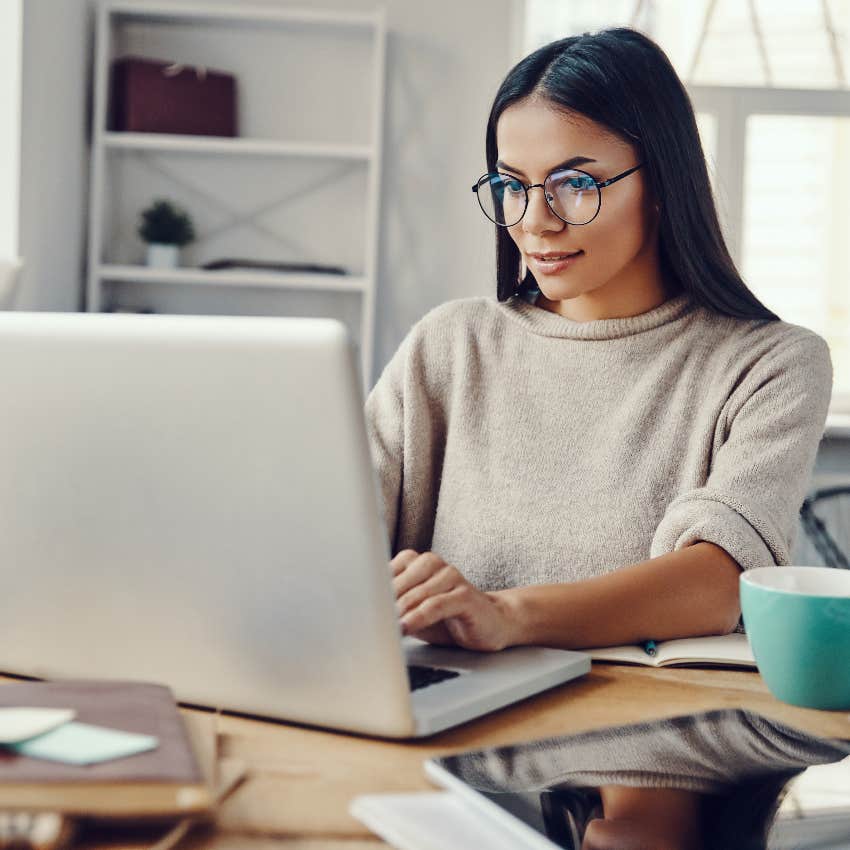 Happy and productive woman working from home