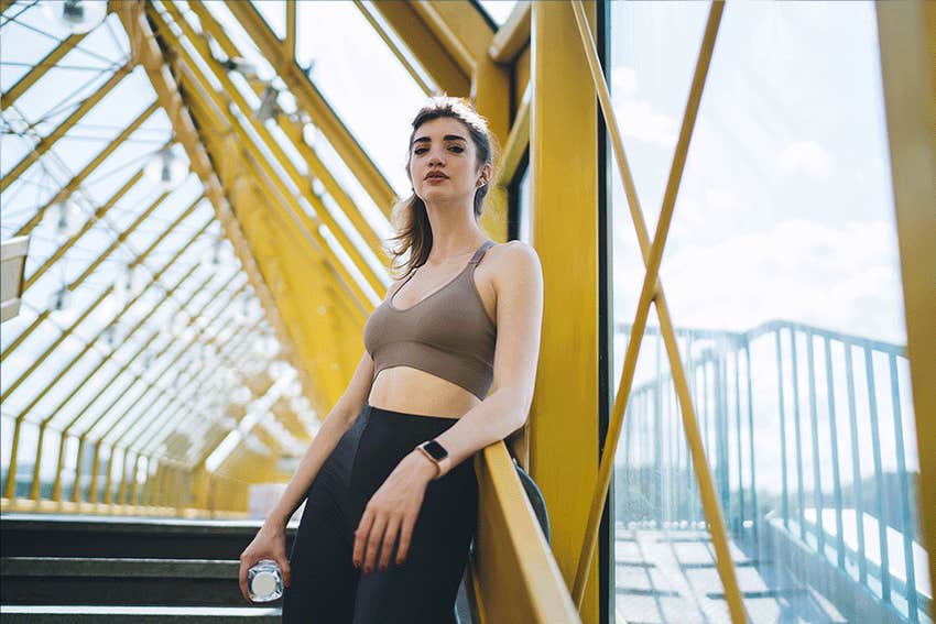 confident woman on a bridge