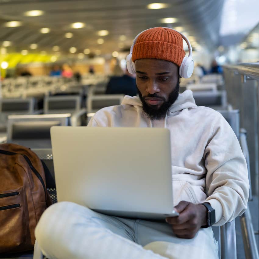 Man working on his laptop during a business trip. 