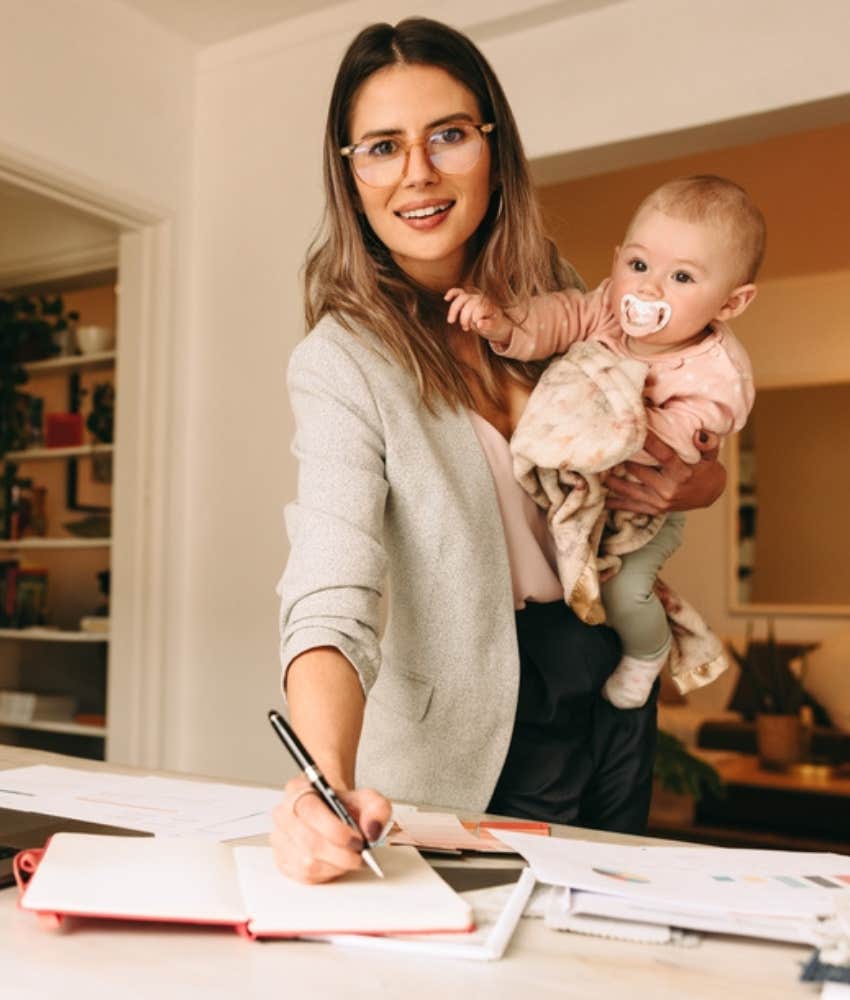 working mom holding baby