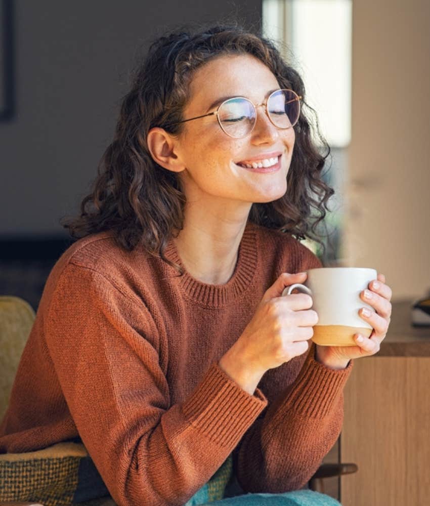 young woman enjoying cup of coffee