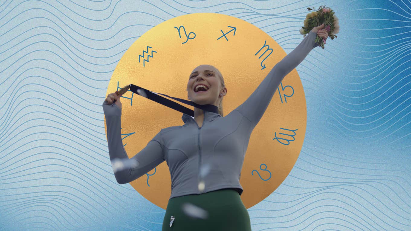 woman holding up olympic gold medal in front of zodiac signs