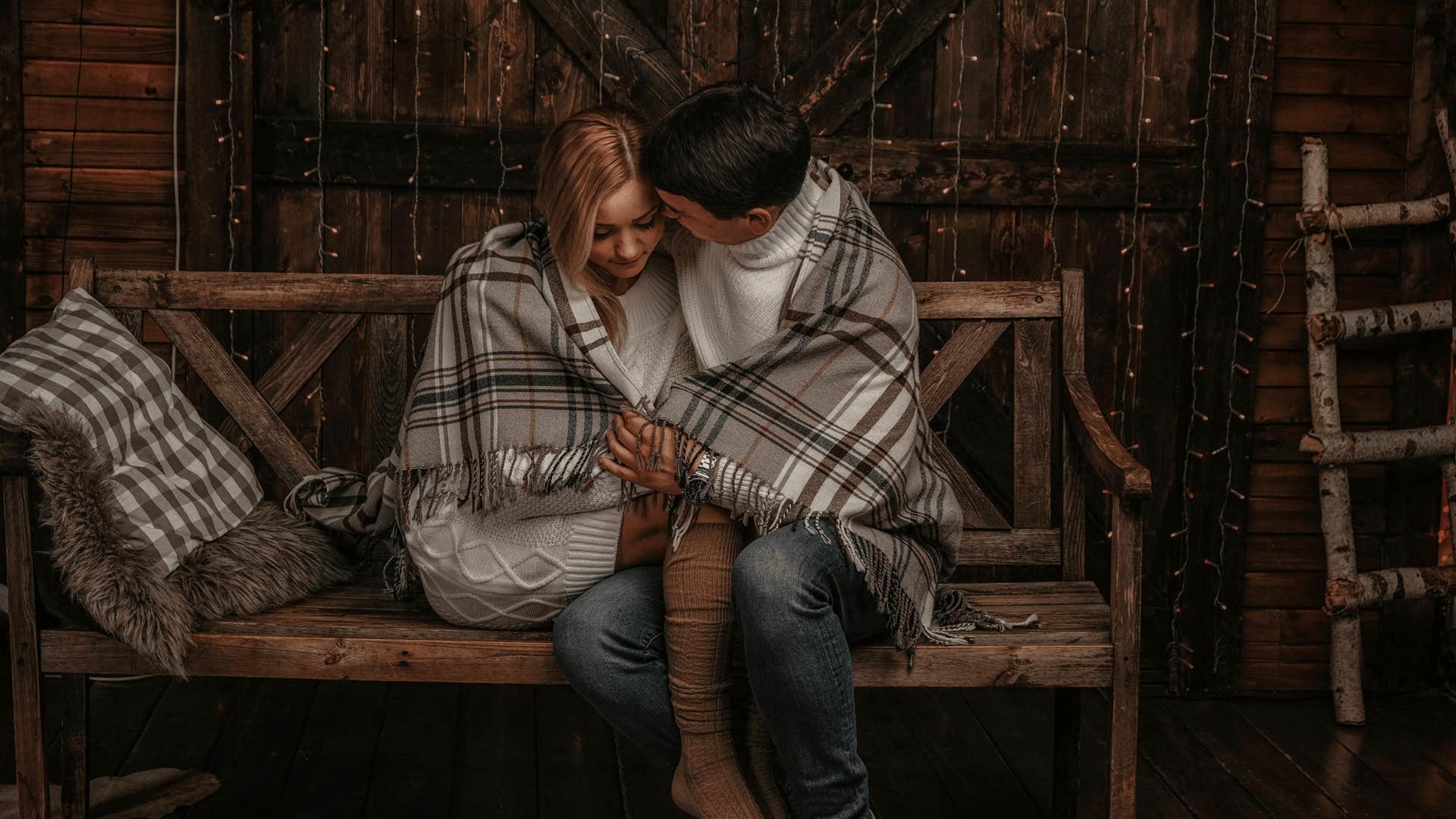 couple wrapped and cuddling in a blanket