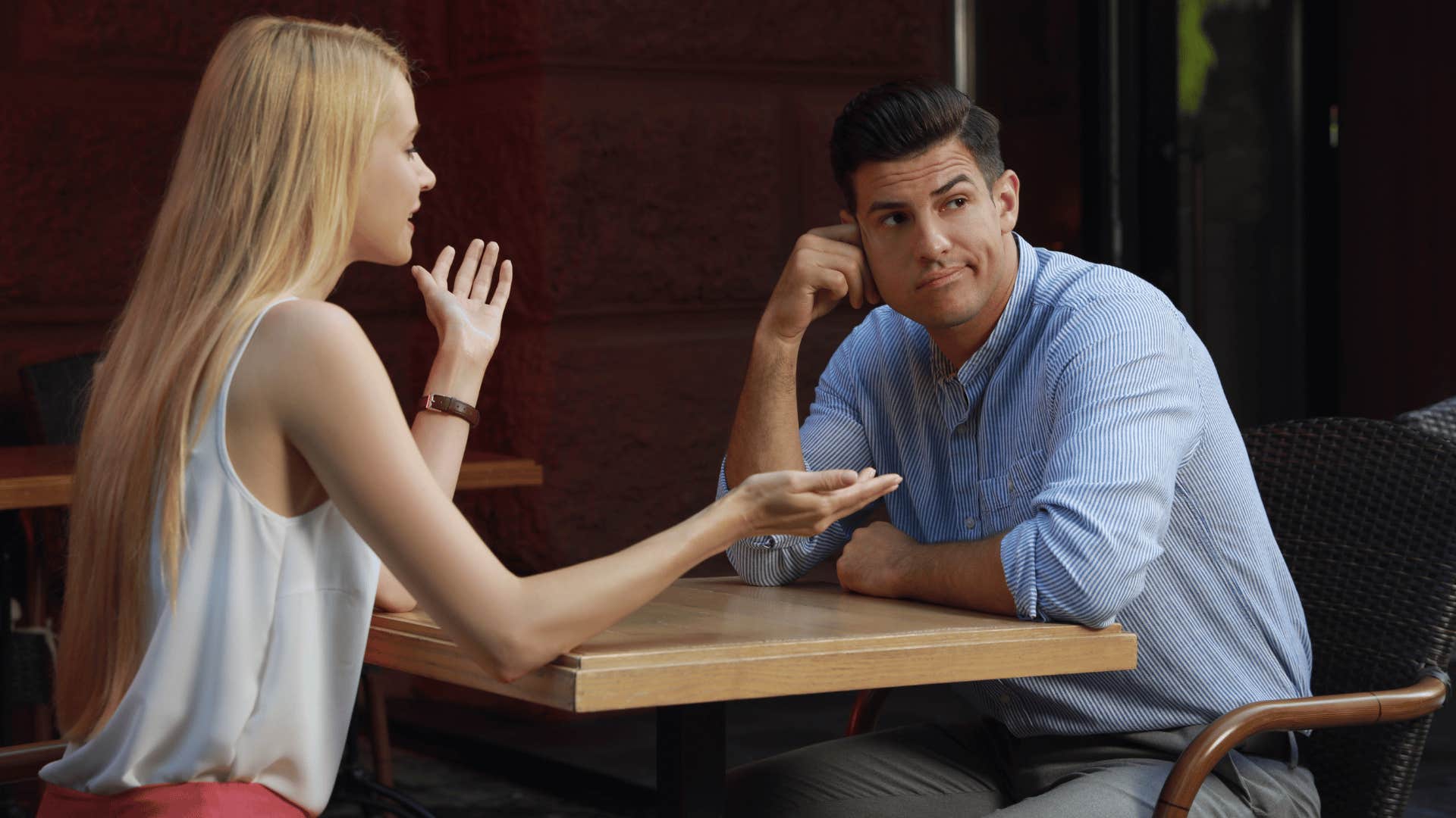 man bored on date with talkative woman