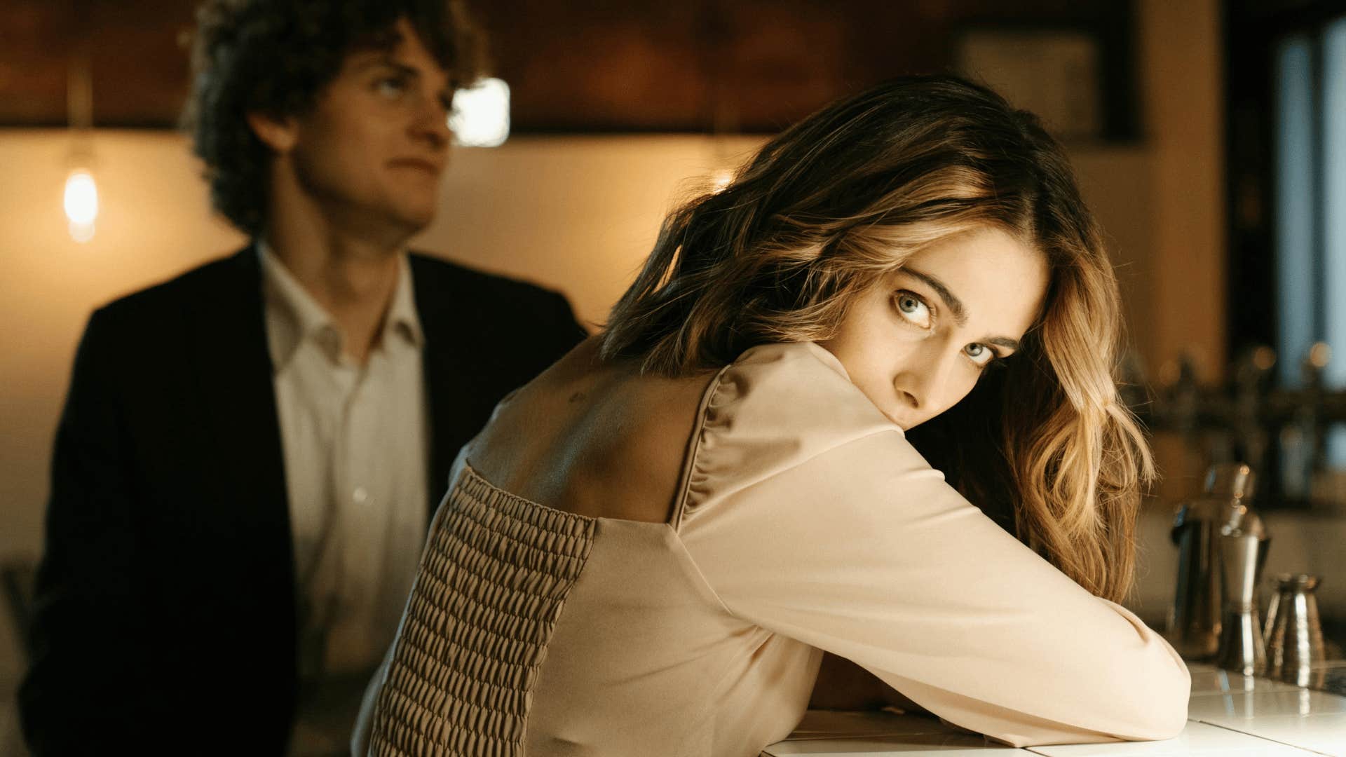 couple on date with woman looking back at camera