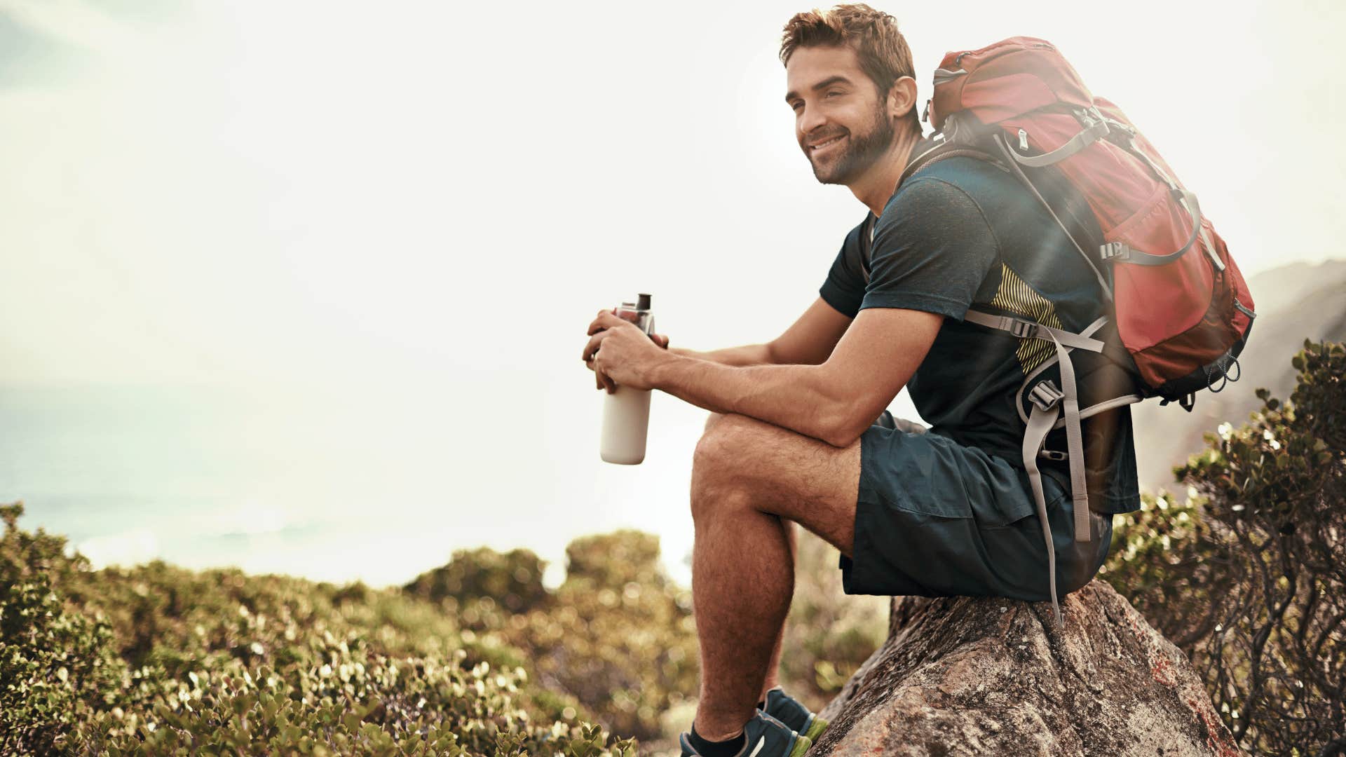 smiling man ready to go on hike