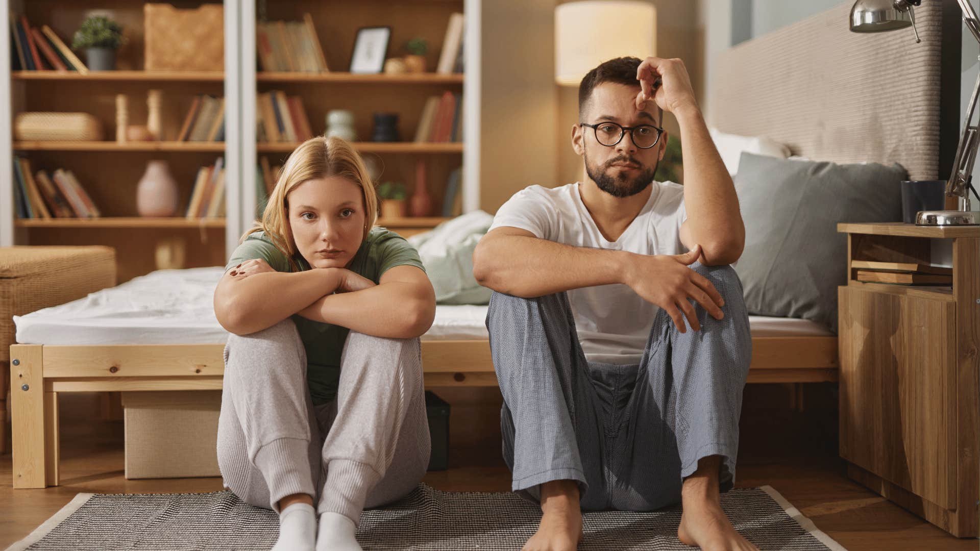 upset couple sitting next to each other