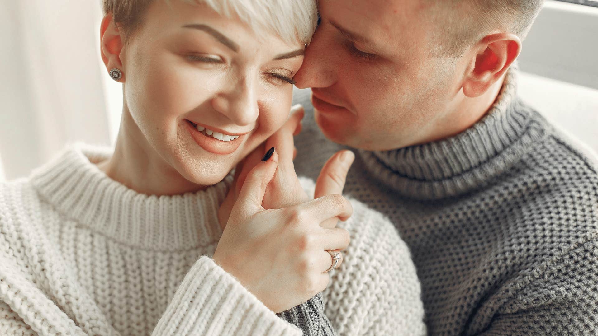 couple in knit sweaters