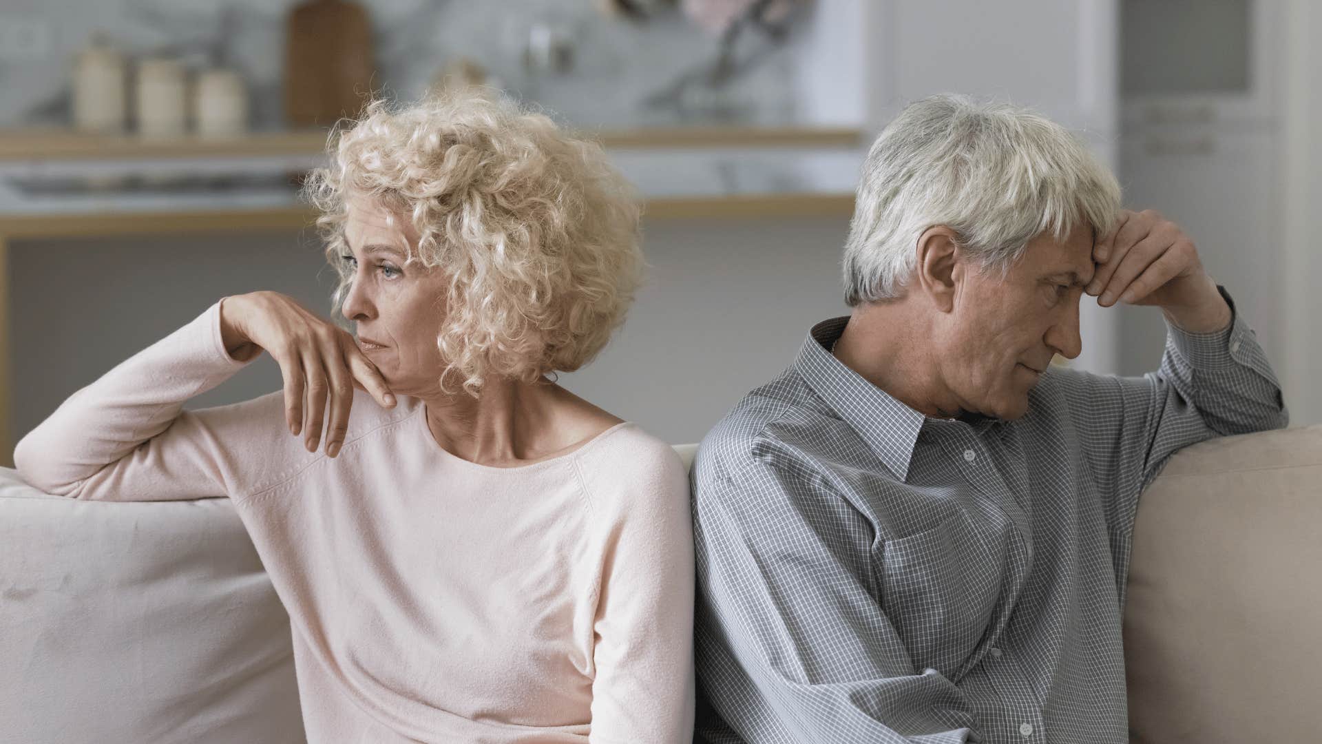 older couple looking away from each other