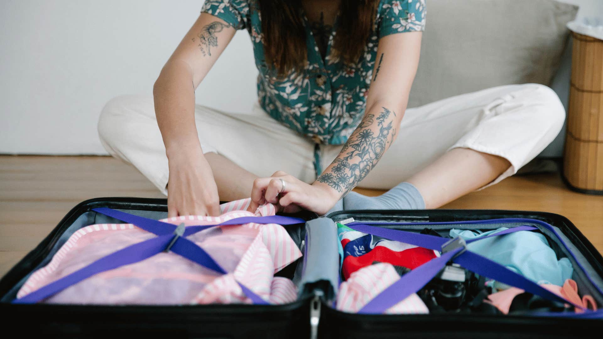 woman packing suitcase