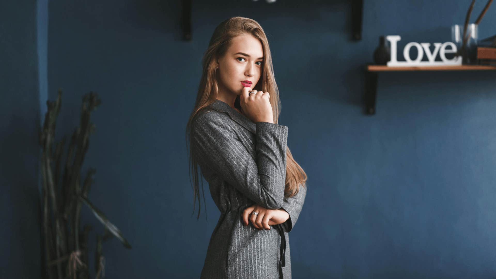 A young woman in a thinking pose