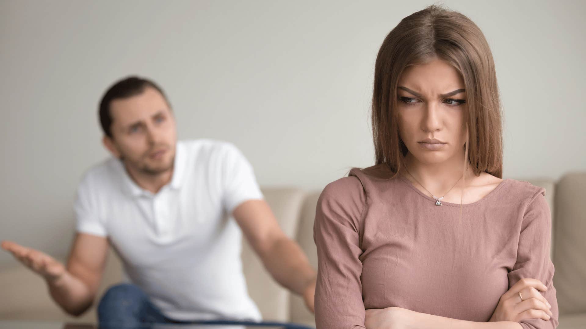 angry woman ignoring man