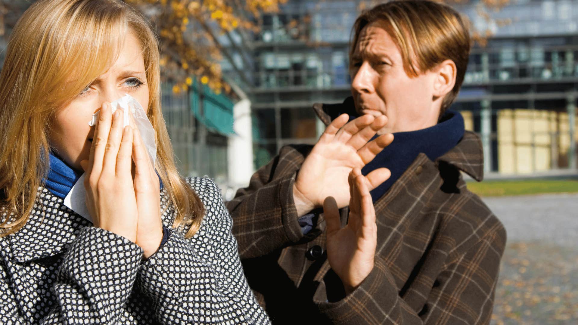 man disgusted by a woman's sneeze