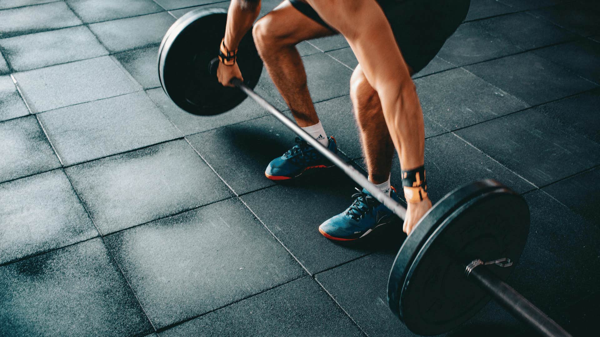 man lifting weights