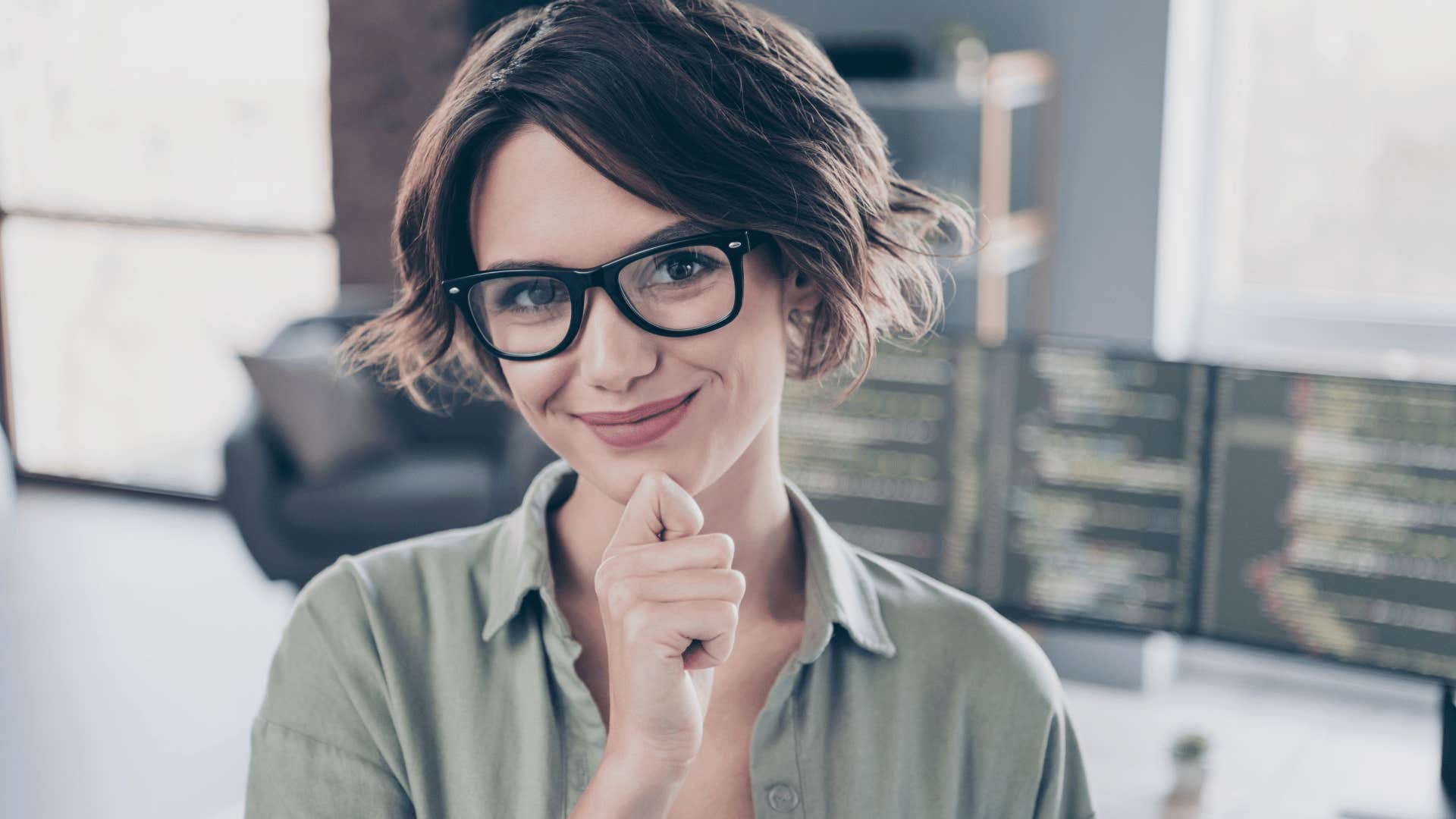 woman in glasses smiling