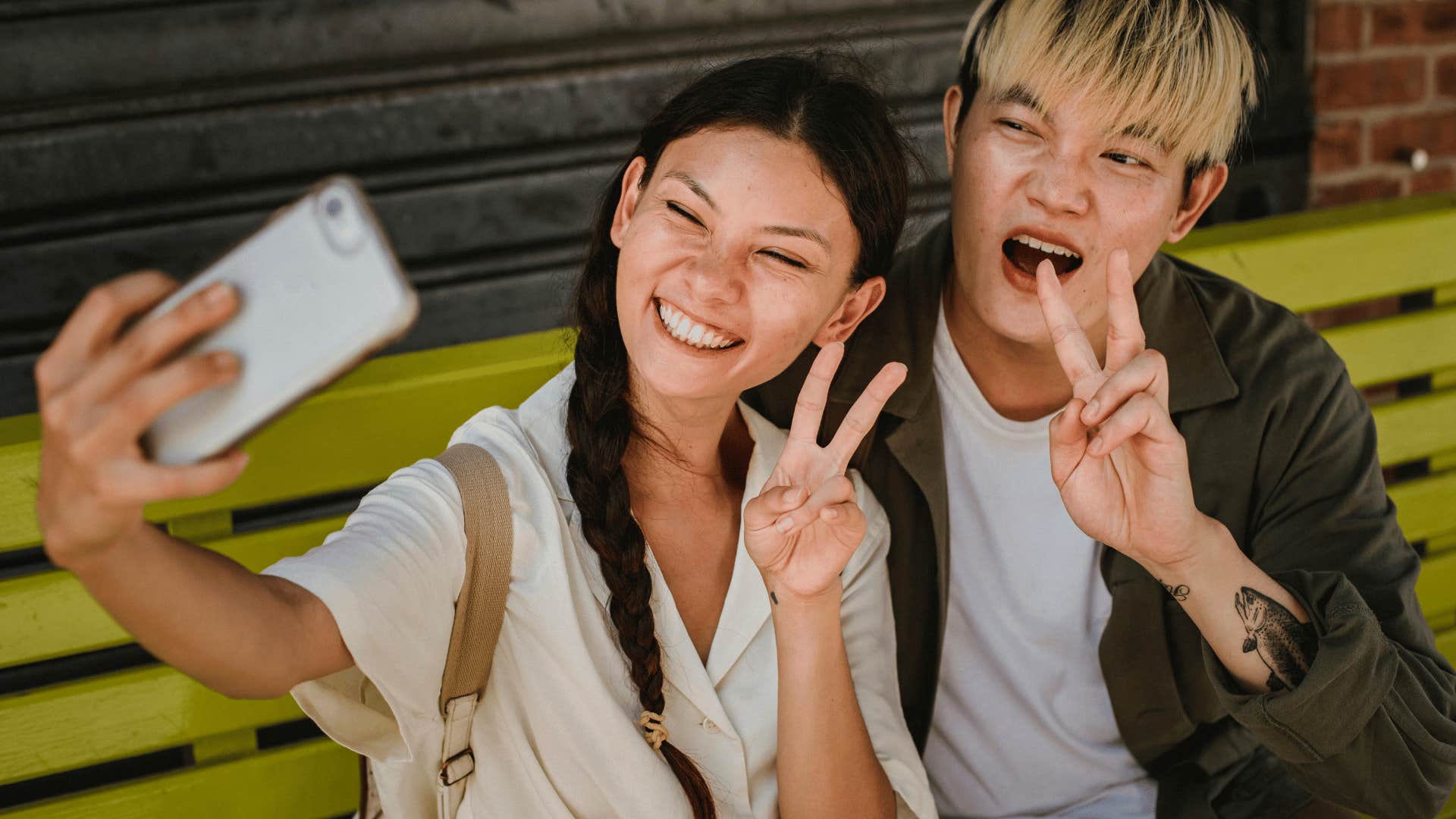 happy couple taking selfie