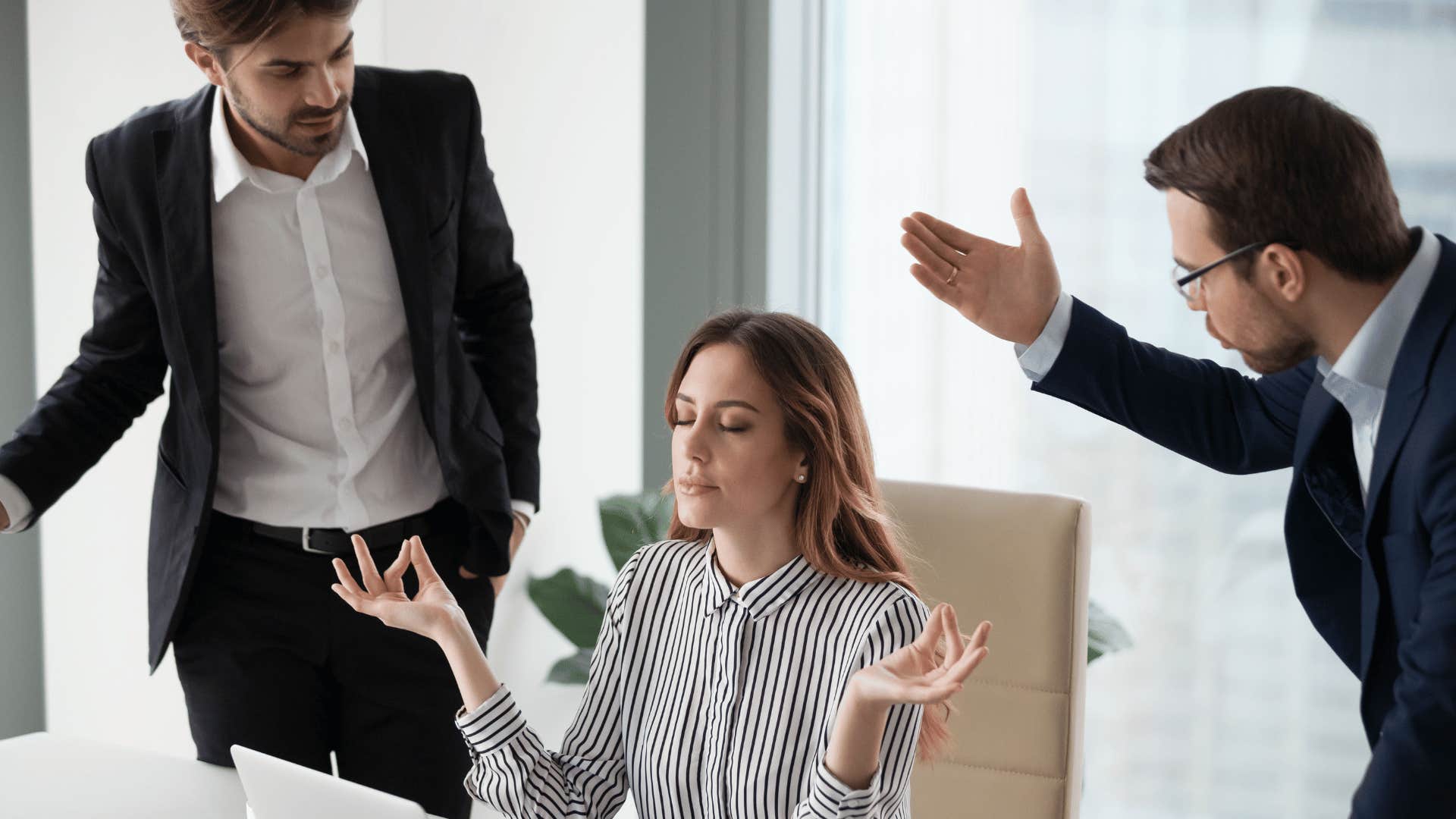 calm corporate woman between two stressed men