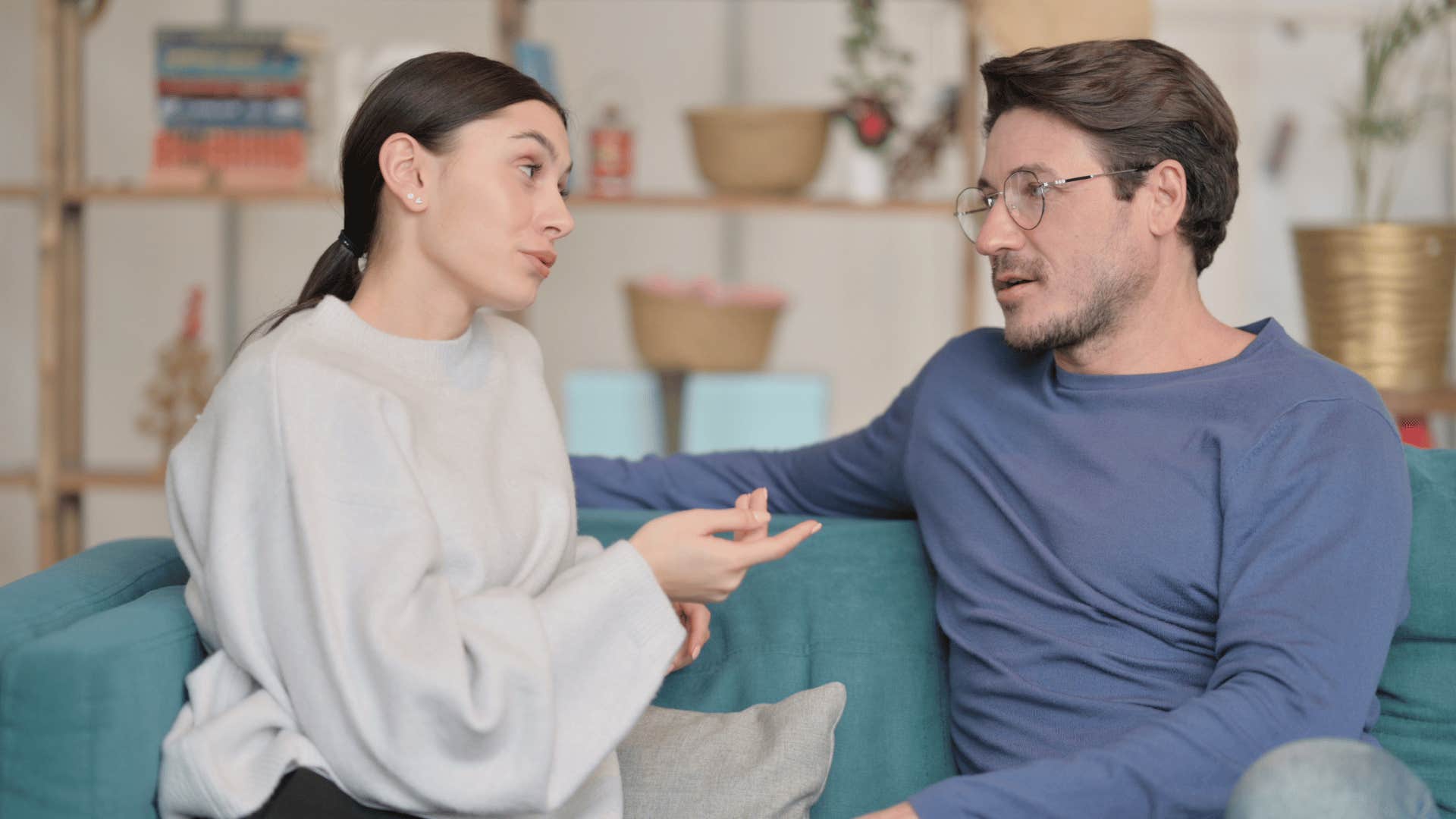 woman speaking to man who is listening