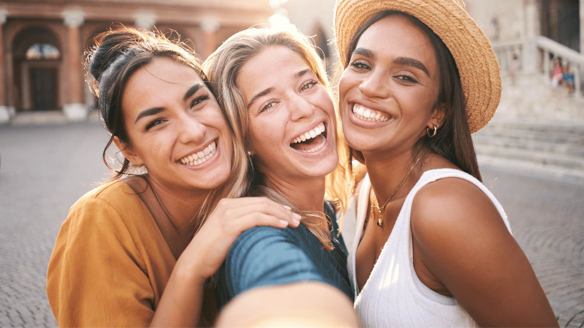 three smiling friends