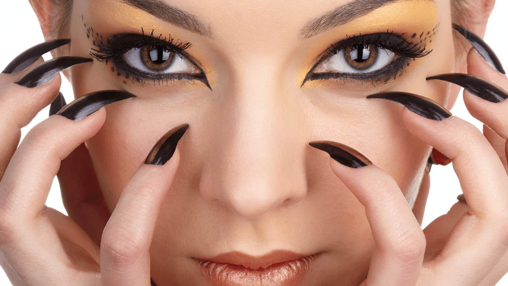 closeup of woman in unique makeup and nails