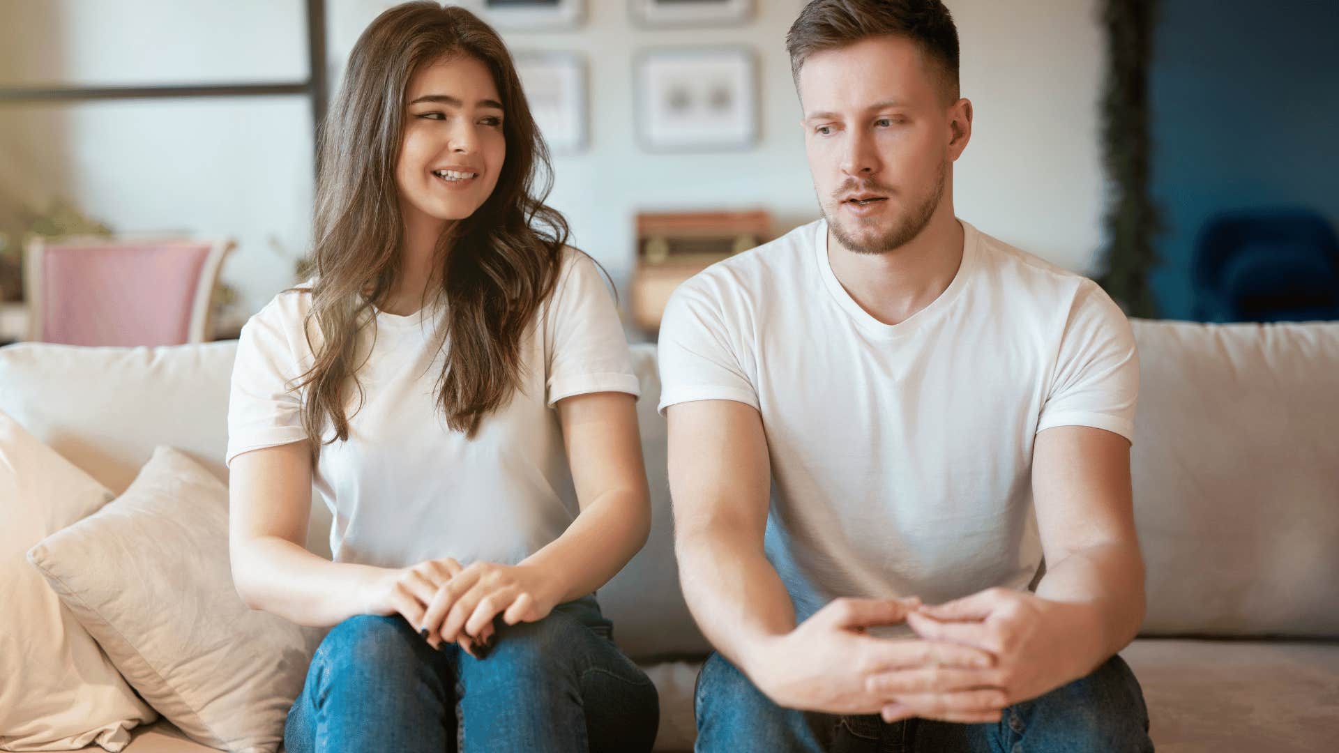 awkward young woman sitting next to an awkward man