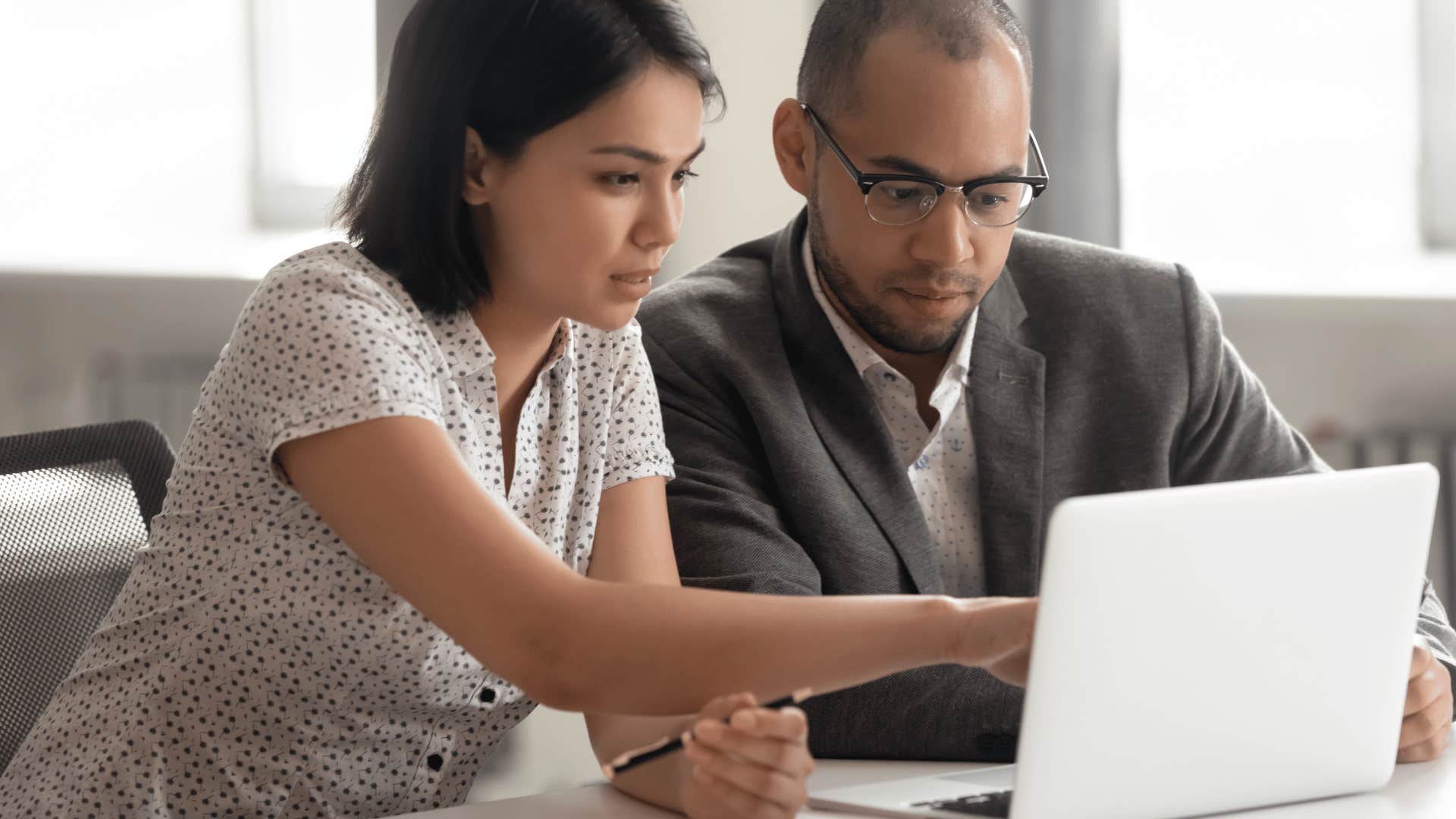 businesswoman giving guidance to businessman