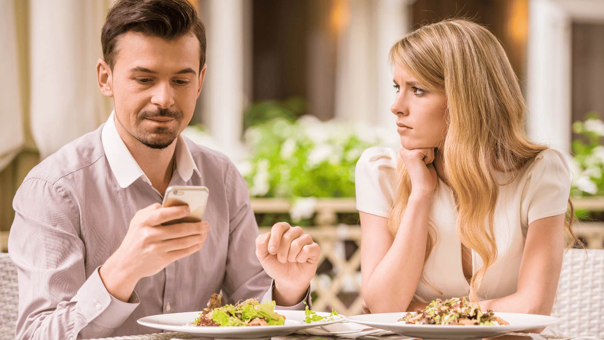 woman ignored by date using phone