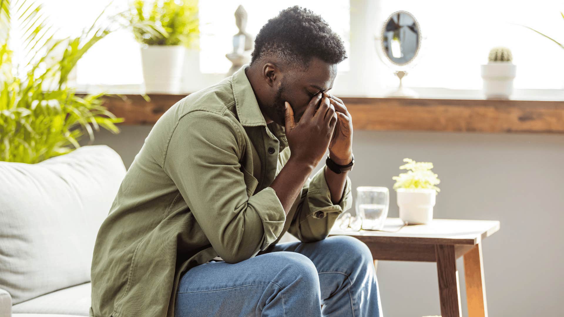 upset man with head in hands