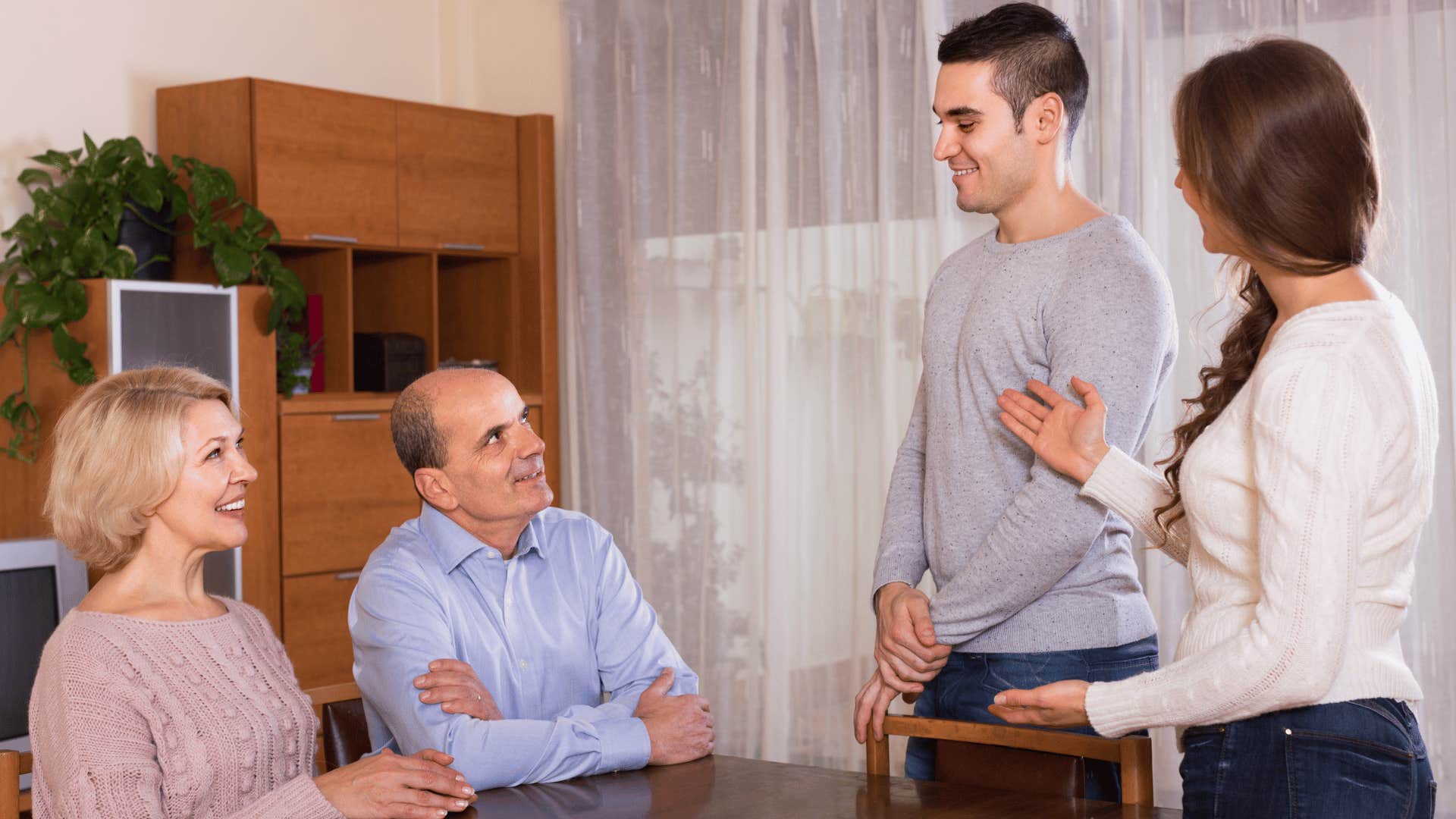 woman introducing man to parents