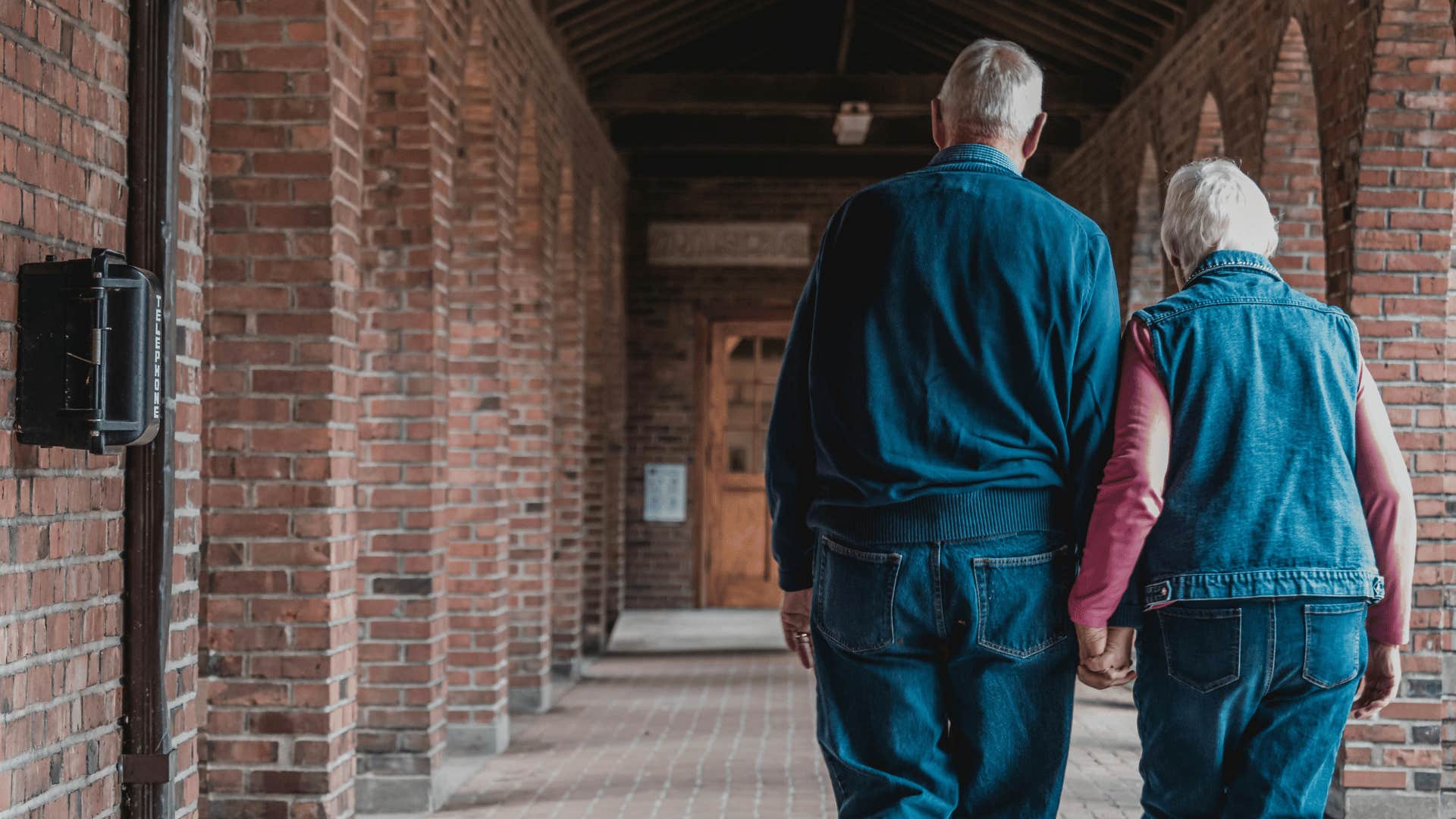 older couple holding hands